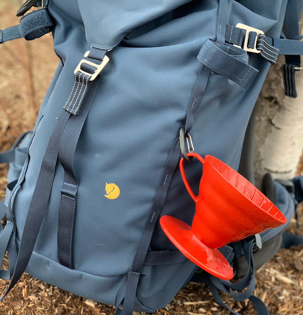 backpack with pour over coffee maker attached